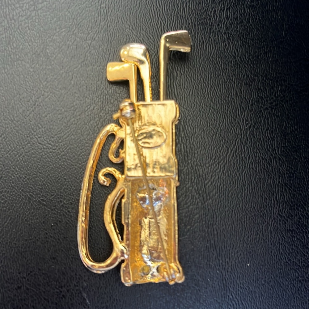 Vintage Golf Bag Brooch Pin
Gold Tone Clubs with Crystals on Black Enamel Bag - Picture 3 of 5